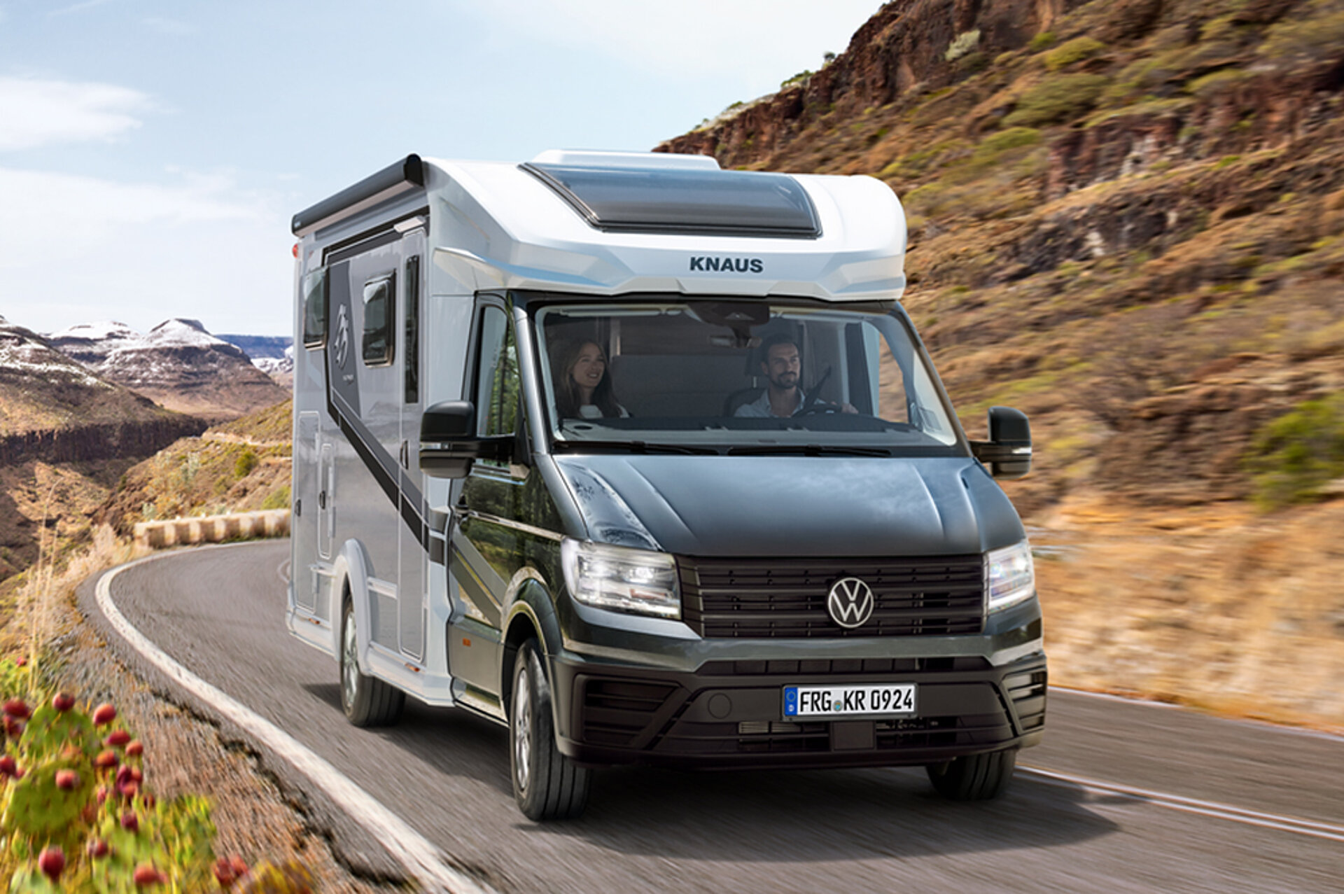 A KNAUS VAN TI as a special edition drives along a mountain road.