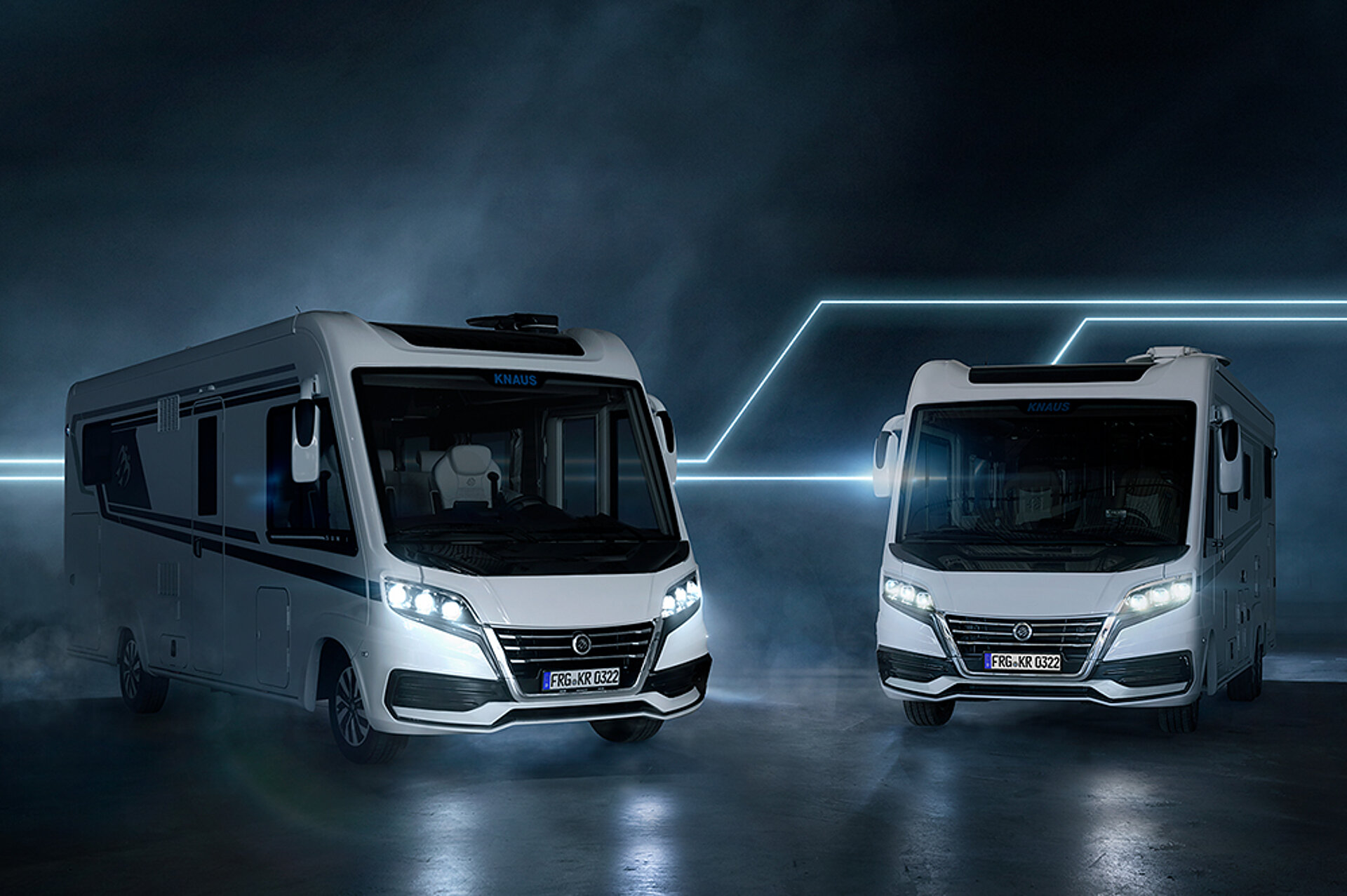 Two SUN I vehicles in front of a futuristic background.