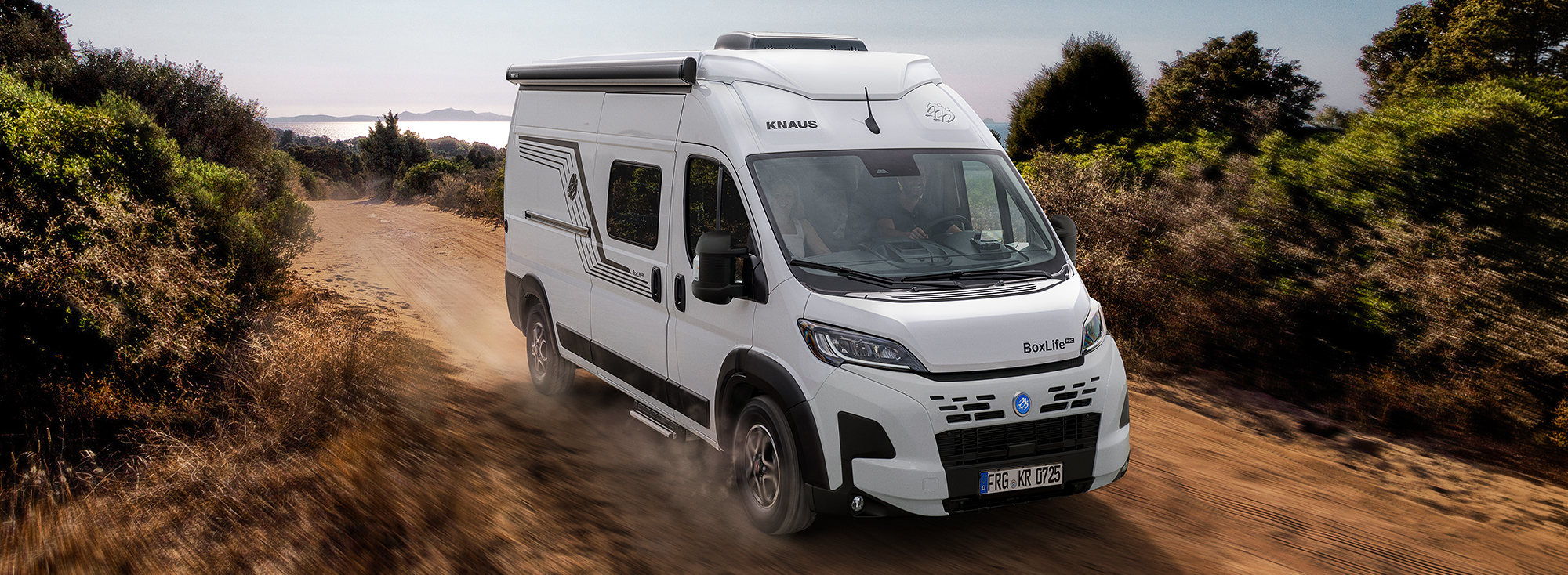 A KNAUS BOXLIFE drives on an off-road track.