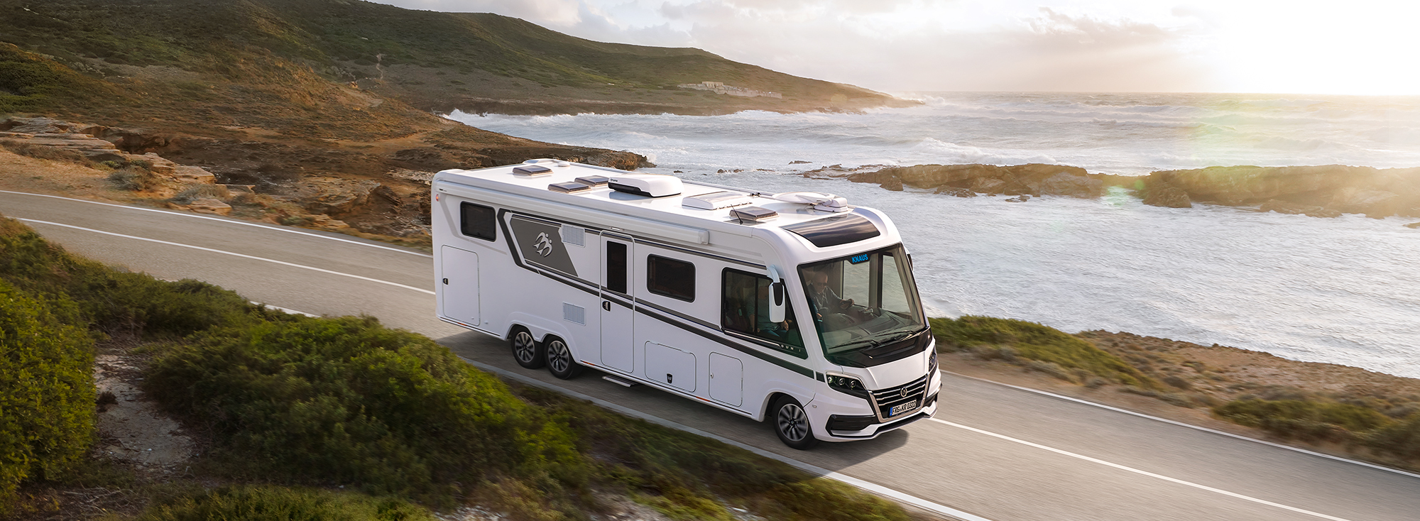 A KNAUS SUN I on a coastal road.